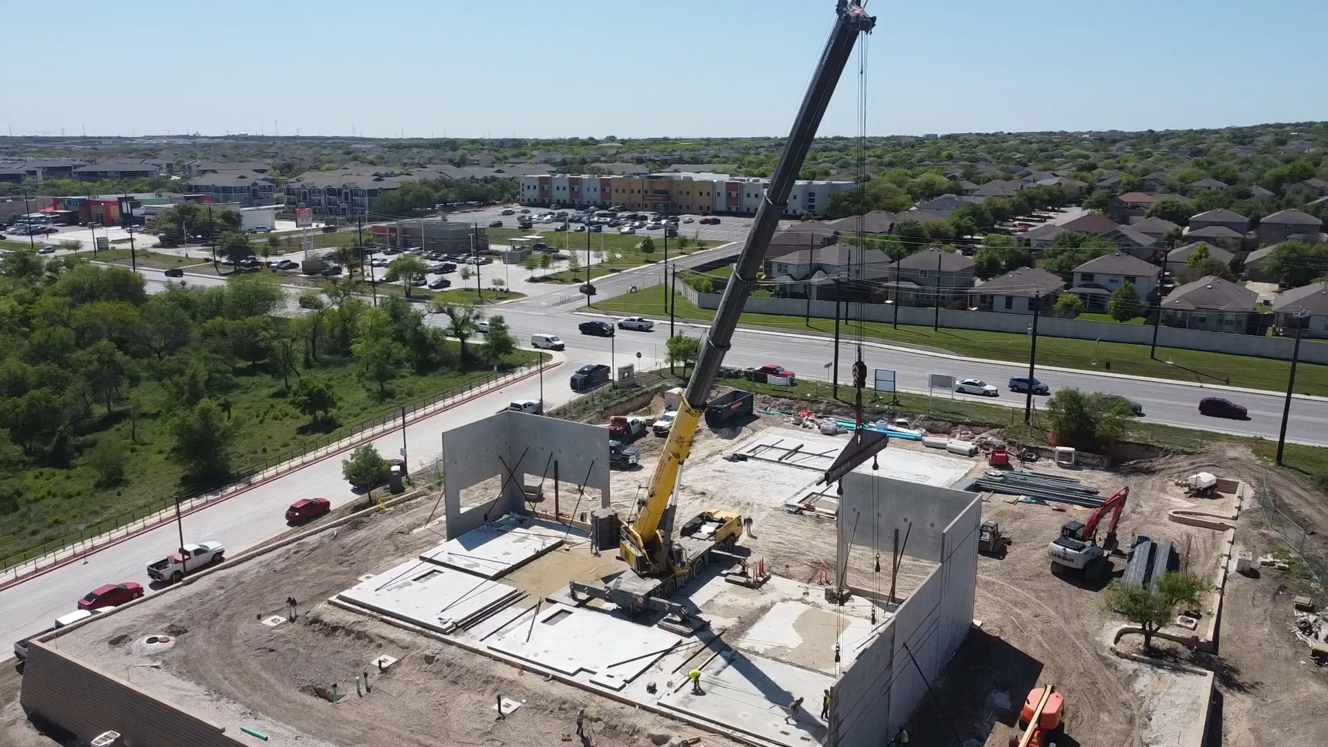 Construction site with crane and machinery.