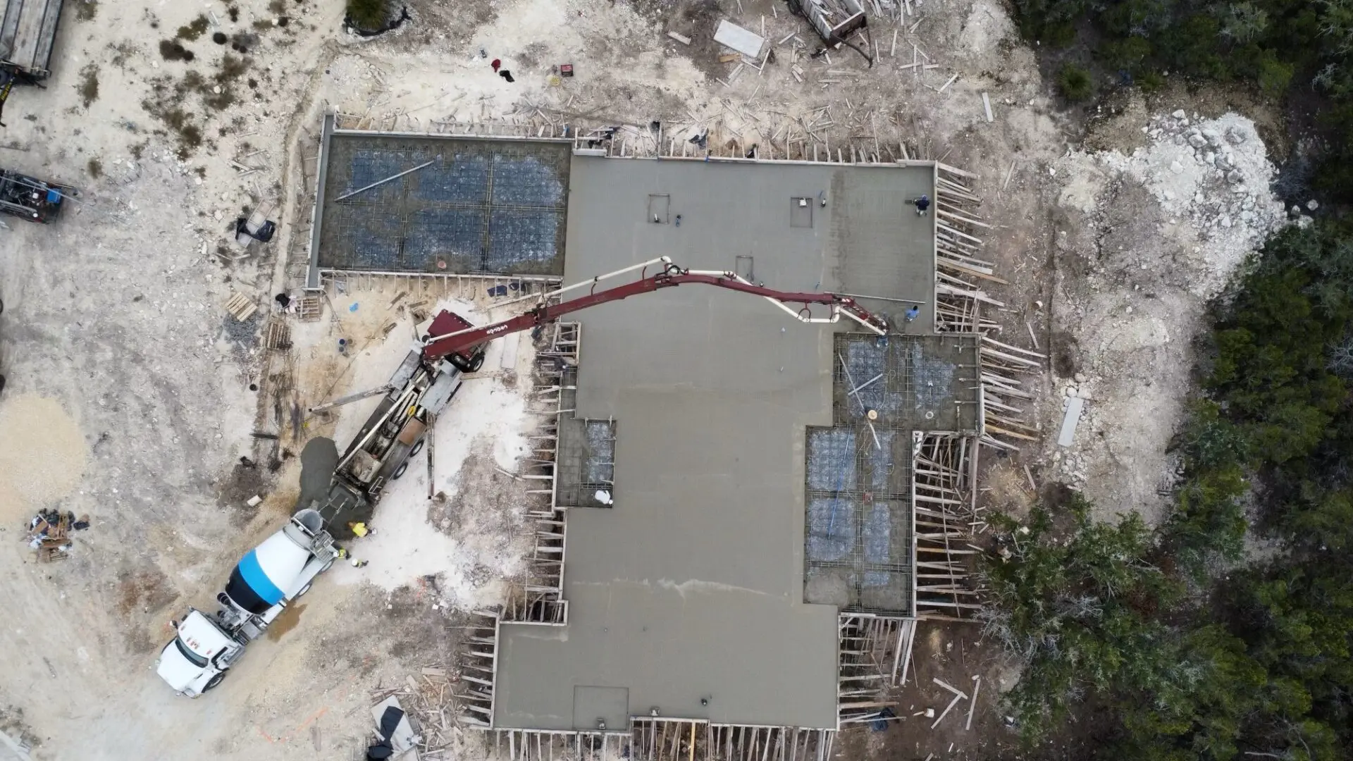 Aerial view of concrete foundation construction site.