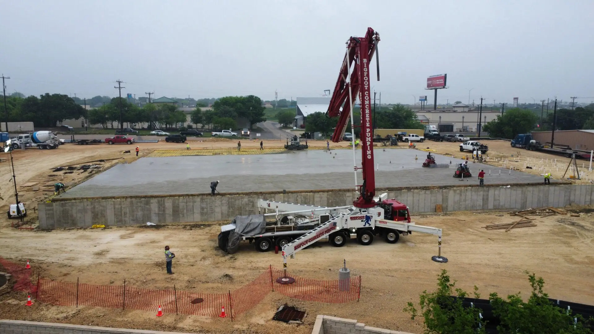 Construction site with crane and workers.